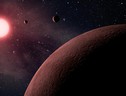 Rappresentazione artistica di un sistema solare con tre pianeti (fonte: NASA) (ANSA)