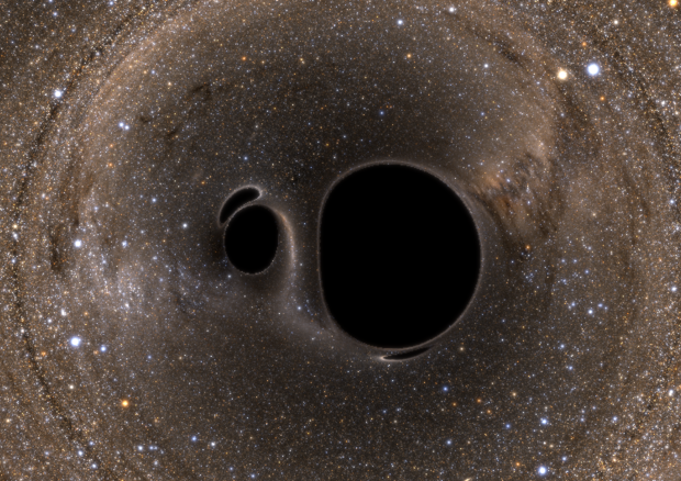 Simulazione al computer di due buchi neri che stanno per entrare in collisione (fonte: SXS Lensing/Simulating eXtreme Spacetimes Collaboration) © Ansa
